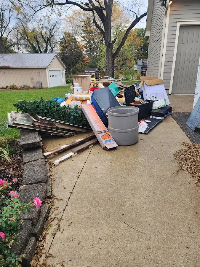 Dumpster being loaded with debris for Commercial Dumpster Rental in Clarksville